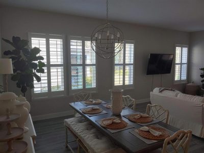 White plantation shutters in a bright Jacksonville dining room